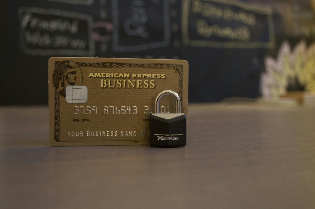 closeup photo of American Express Business card on brown surface