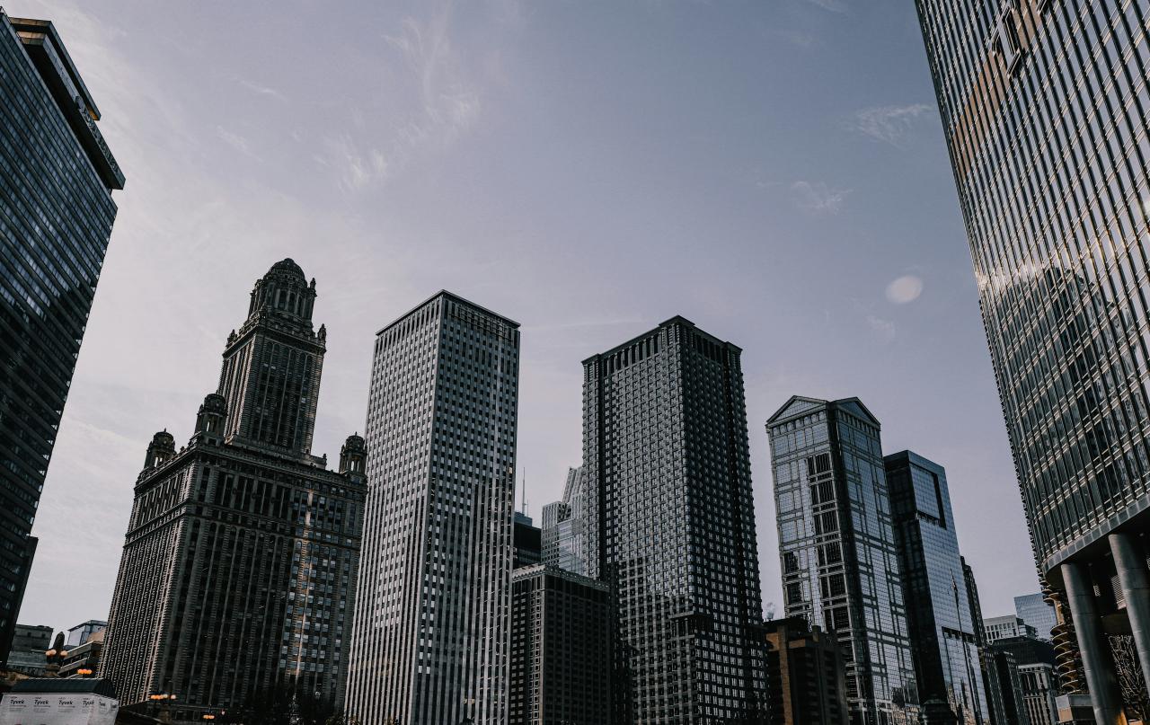 a city skyline with tall buildings